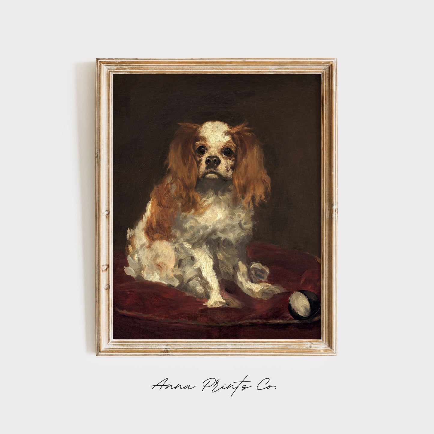 Vintage art print of King Charles Spaniel by Manet displayed in wooden frame