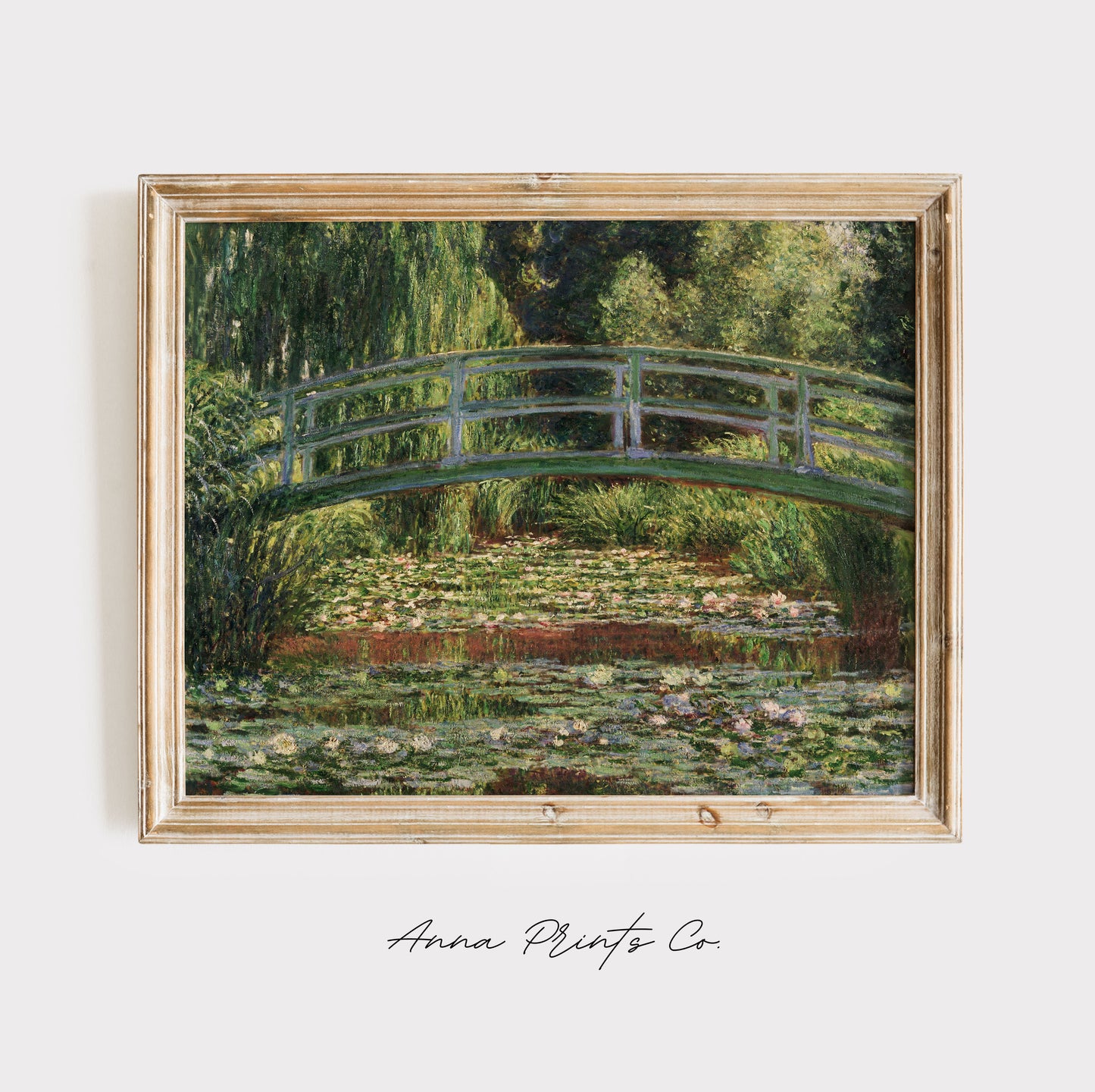 Vintage art print of The Japanese Footbridge by Monet displayed in wooden frame