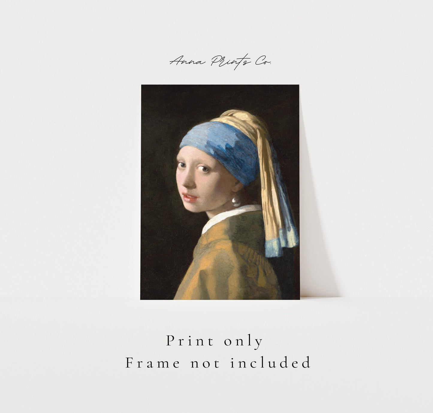 Vintage art print of Girl with a Pearl Earring by Vermeer with text overlay stating frame not included