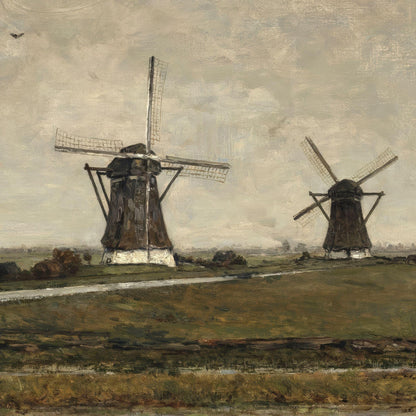 Two windmills in a landscape with a cloudy sky