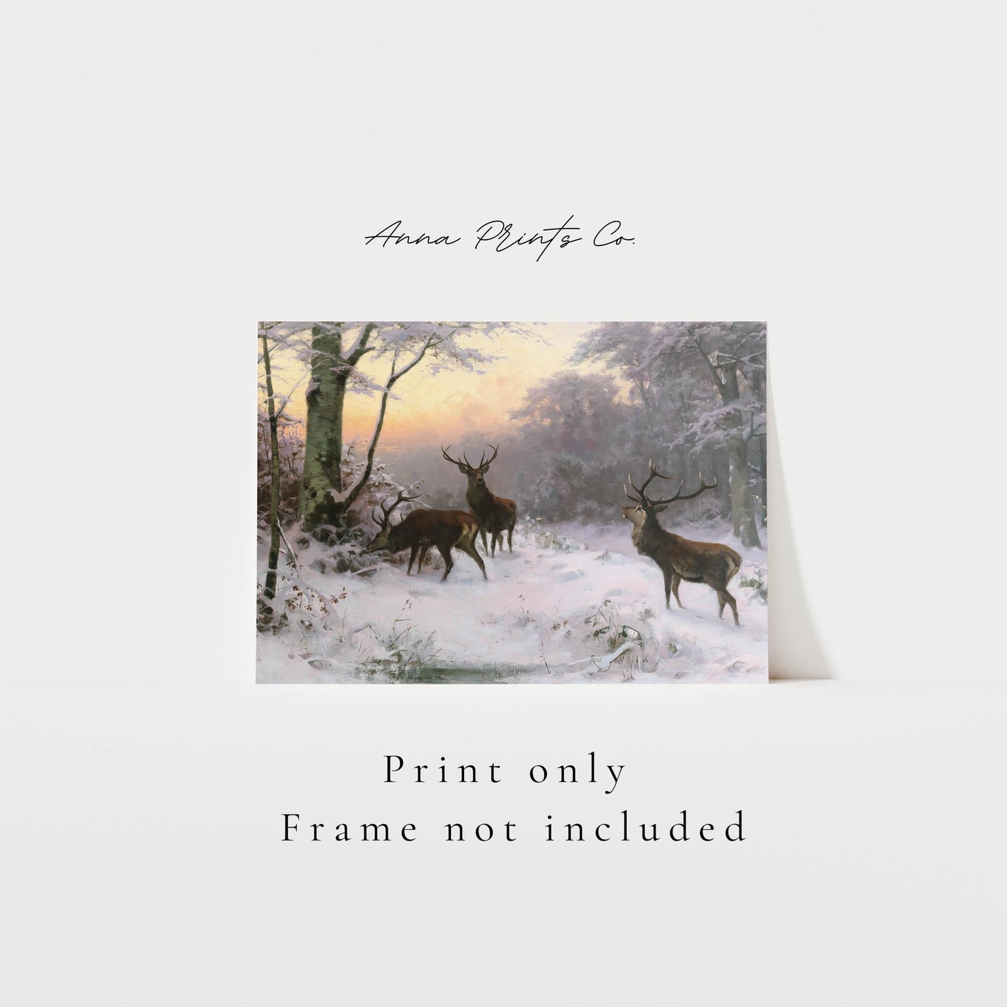 Vintage art print of Deer in Winter Forest Landscape with text overlay stating frame not included