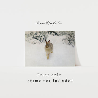 Vintage art print of Hare in Winter Landscape Painting with text overlay stating frame not included