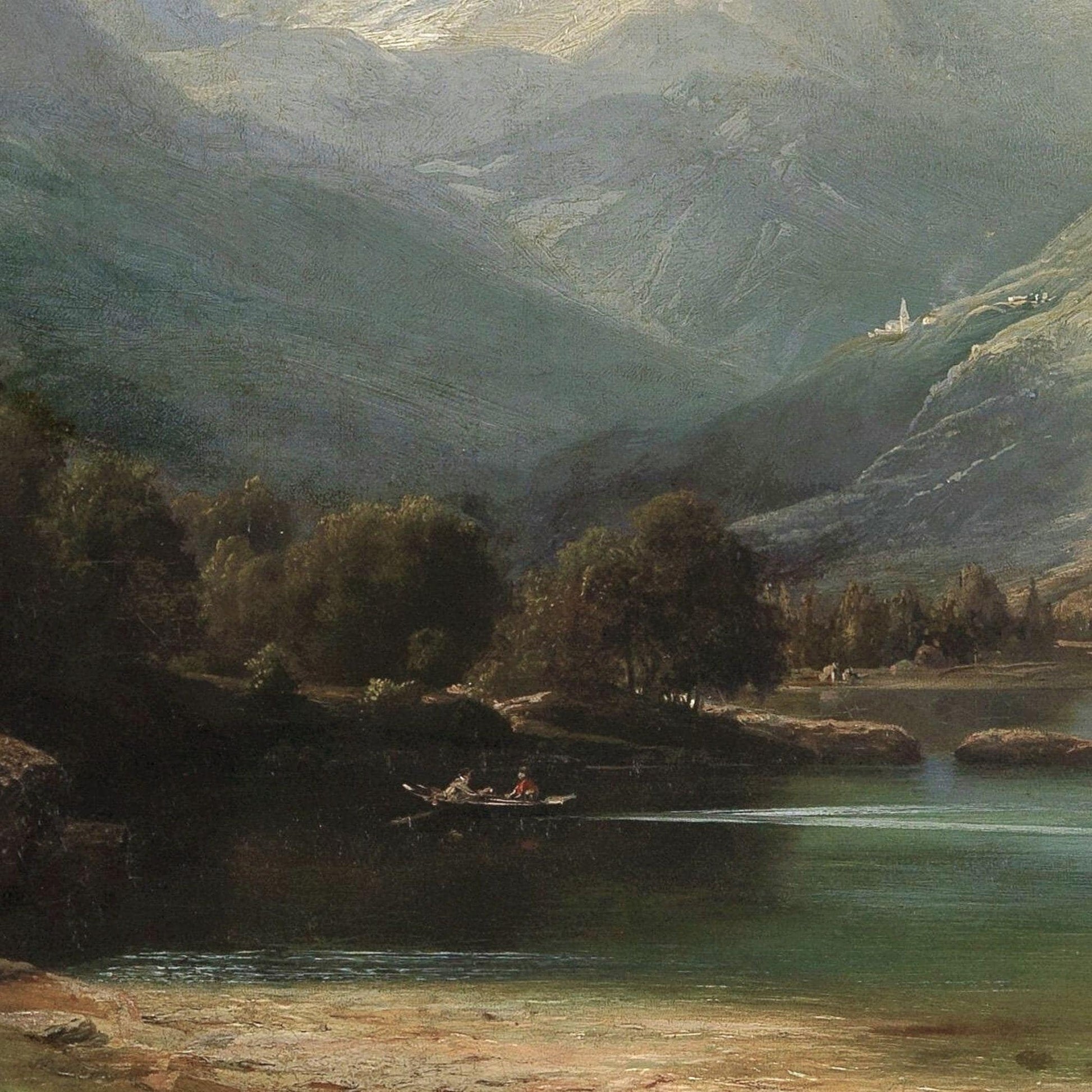 Two people in a boat on a lake with mountains in the background