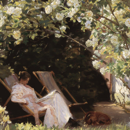 Woman in a white dress sitting in a garden with white flowers and a dog.