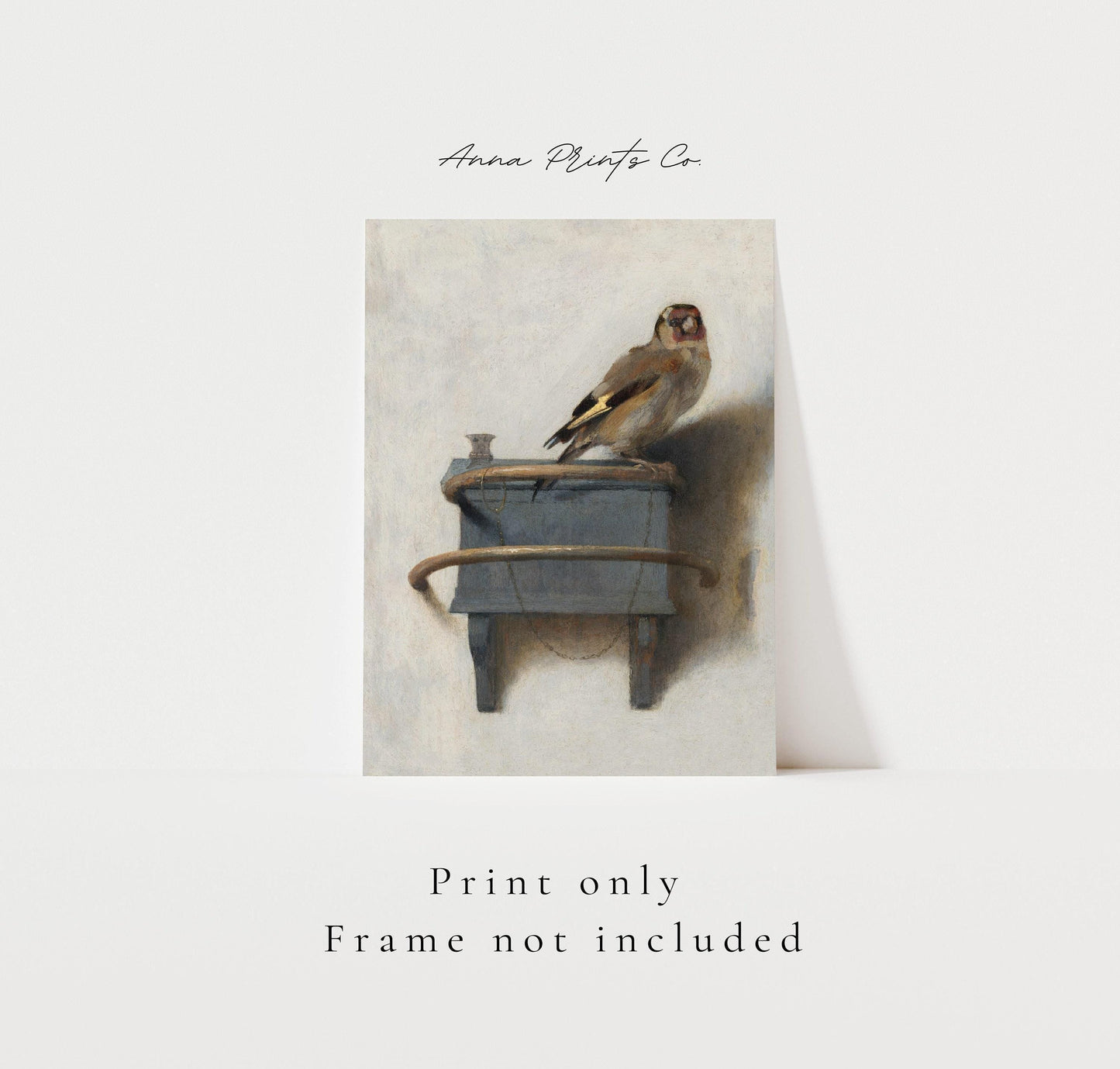 Vintage art print of The Goldfinch by Fabritius with text overlay stating frame not included