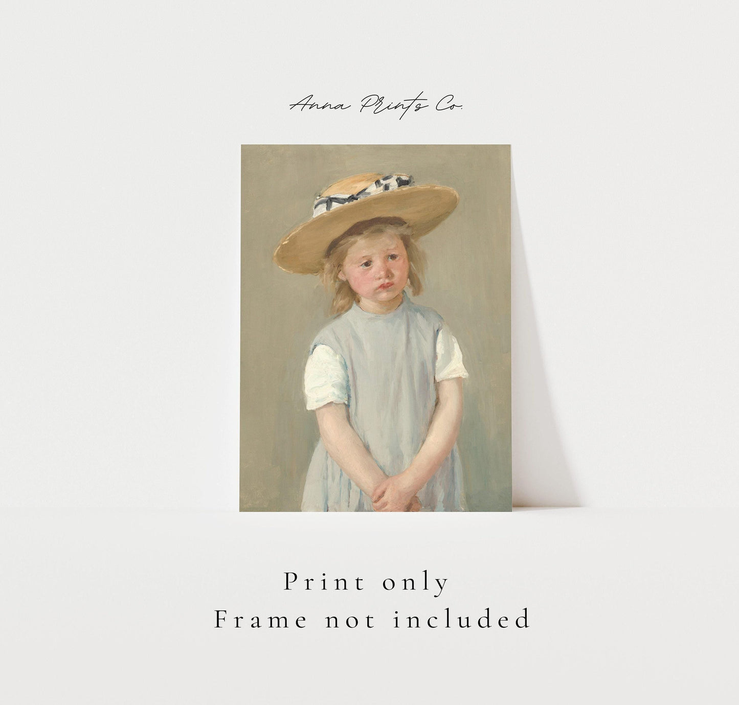 Vintage art print of Child in a Straw Hat by Cassatt with text overlay stating frame not included
