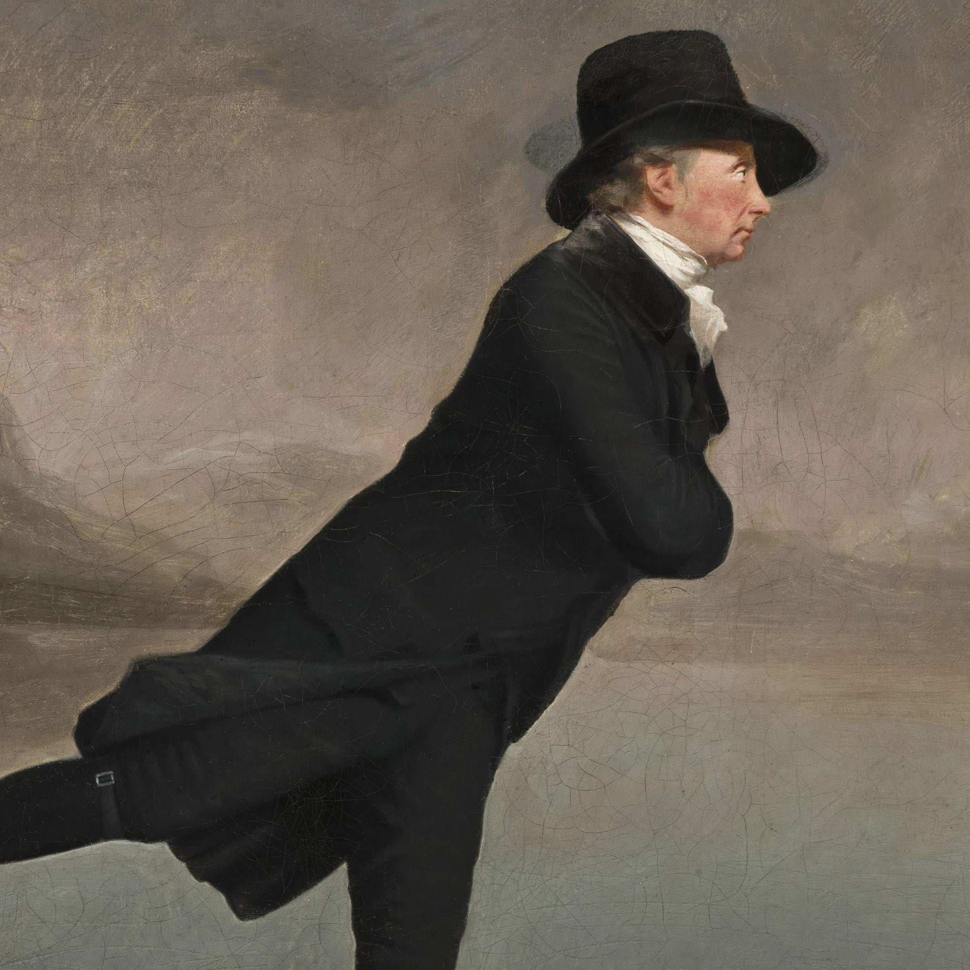 Man in a black coat and hat against a plain background