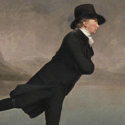 Man in a black coat and hat against a plain background