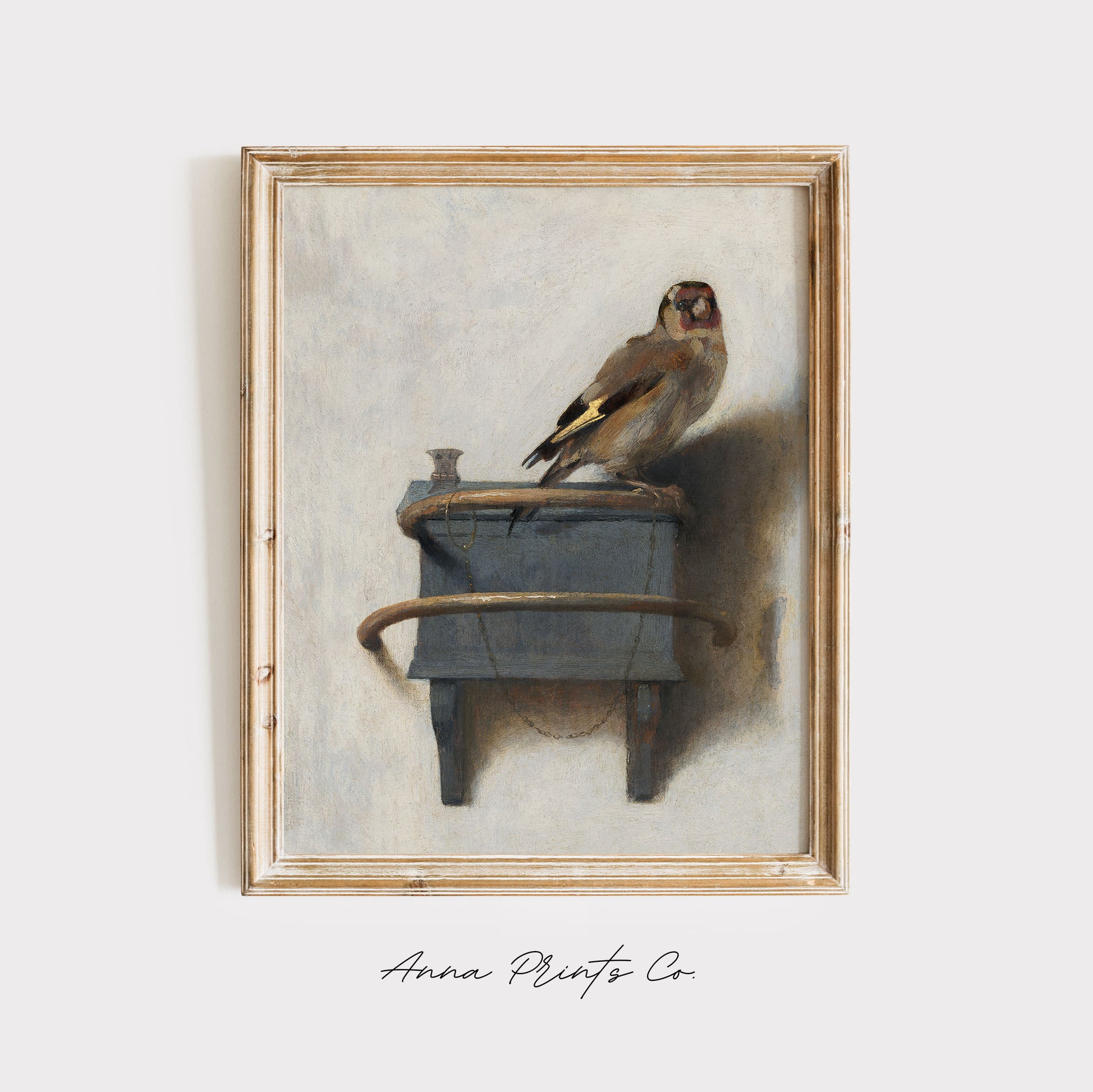 Vintage art print of The Goldfinch by Fabritius displayed in wooden frame