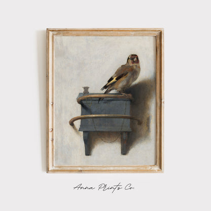 Vintage art print of The Goldfinch by Fabritius displayed in wooden frame