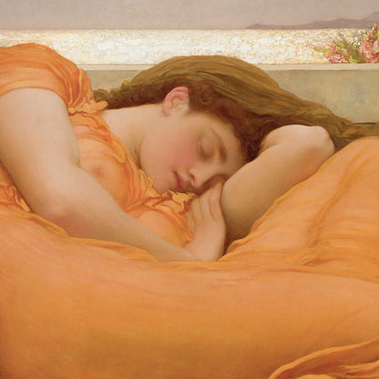 Woman in an orange dress lying down with a soft, blurred background