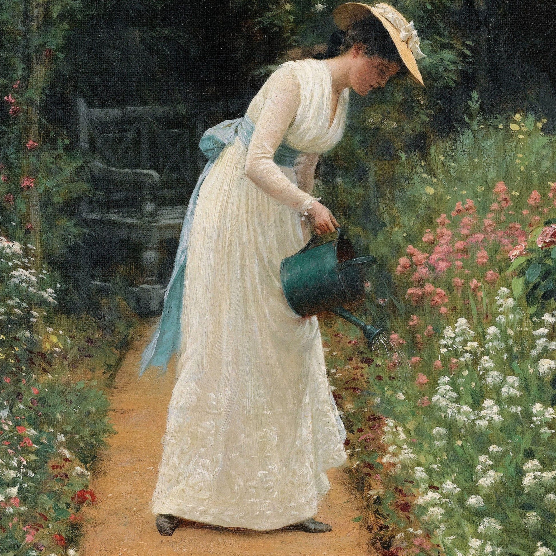 Woman in a garden watering flowers with a watering can
