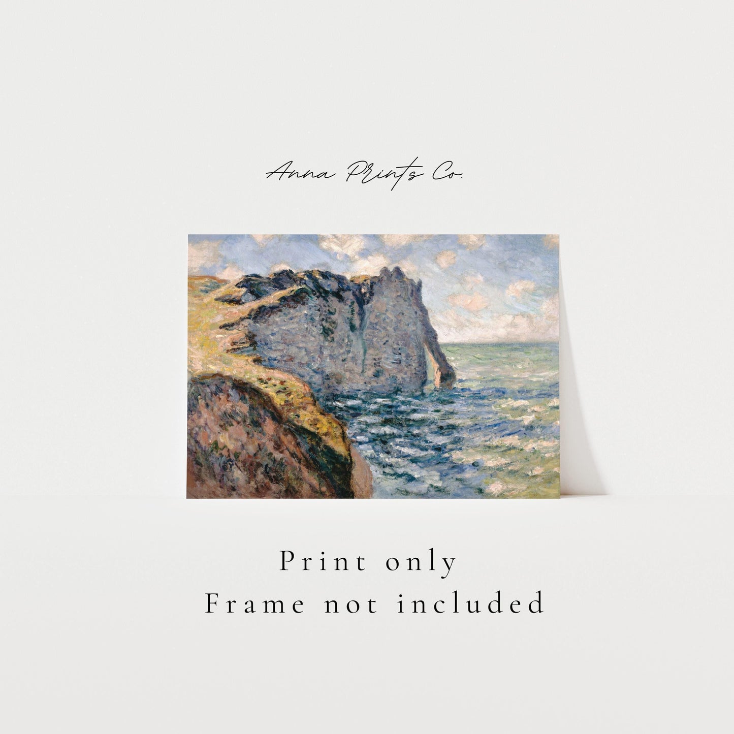 Vintage art print of The Cliff of Aval, Etretat by Monet with text overlay stating frame not included
