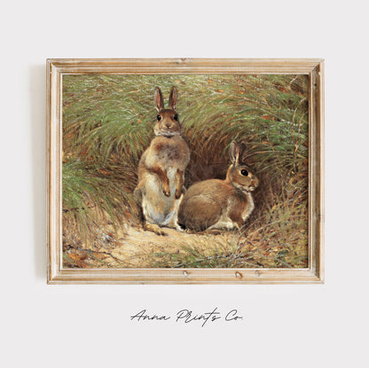 Vintage art print of Rabbits Cottage Animal Painting displayed in wooden frame