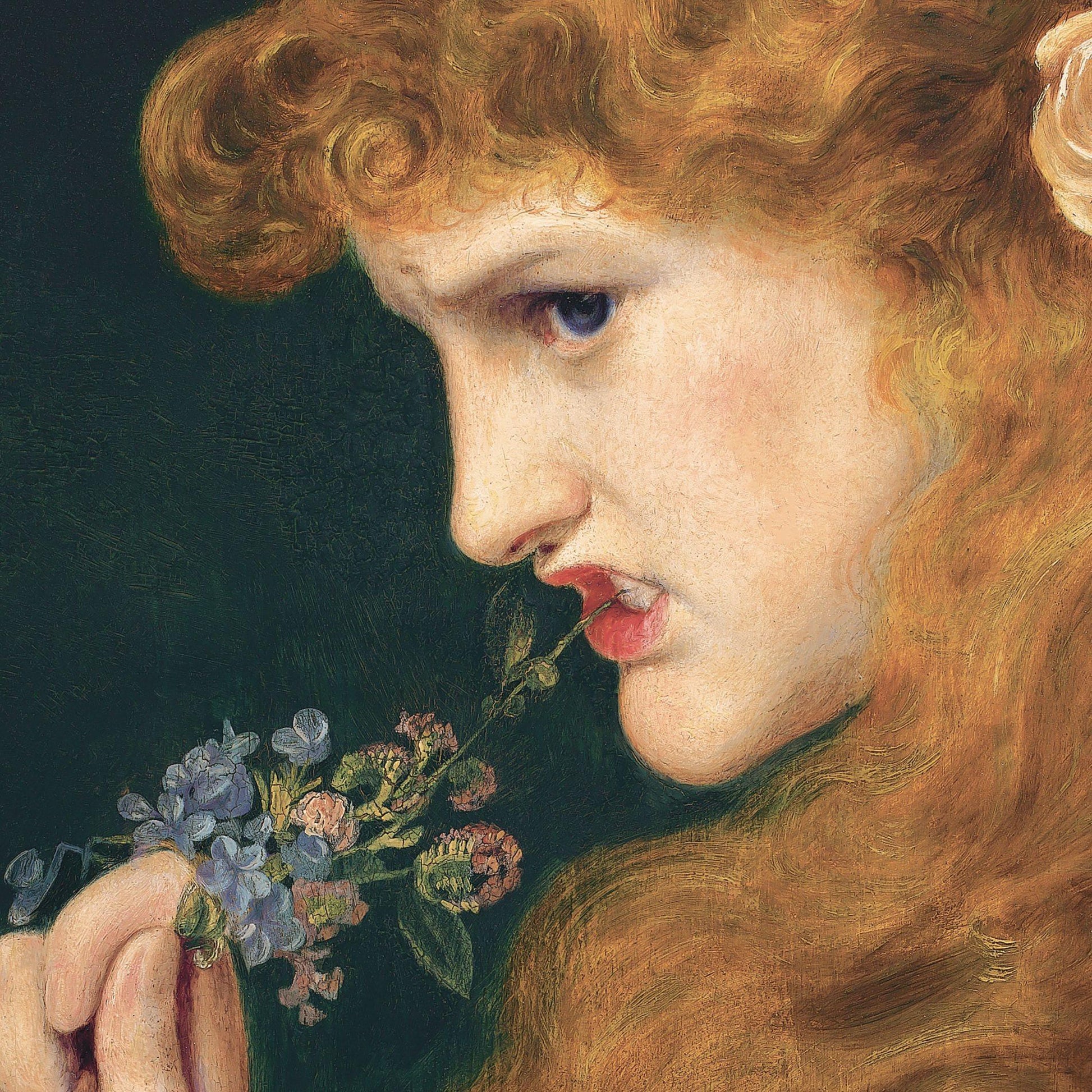 Close-up of a classical painting of a young woman with red hair smelling flowers against a dark background
