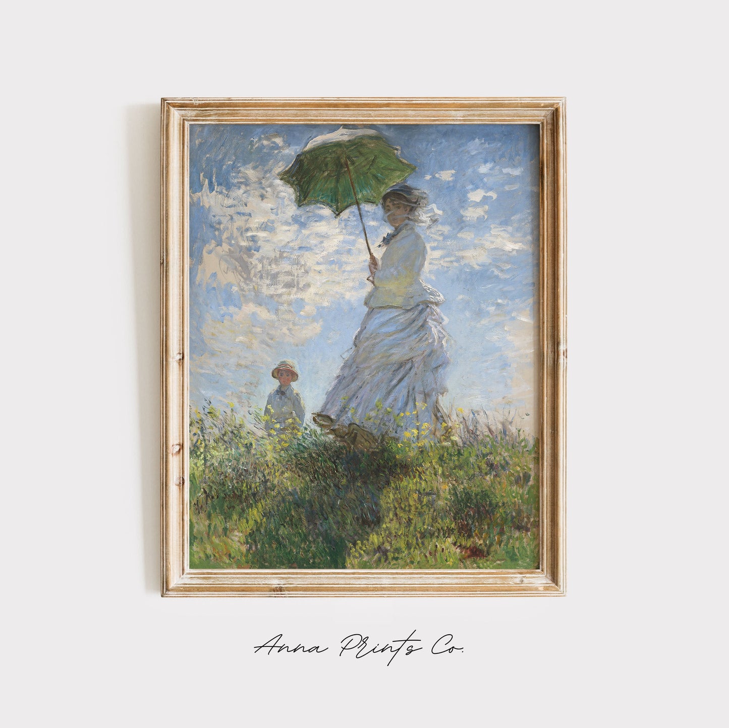 Vintage art print of Woman with a Parasol by Monet displayed in wooden frame