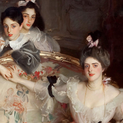 Portrait of two women in formal attire with a decorative mirror in the background