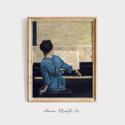 Vintage art print of Woman Playing Piano Painting displayed in wooden frame