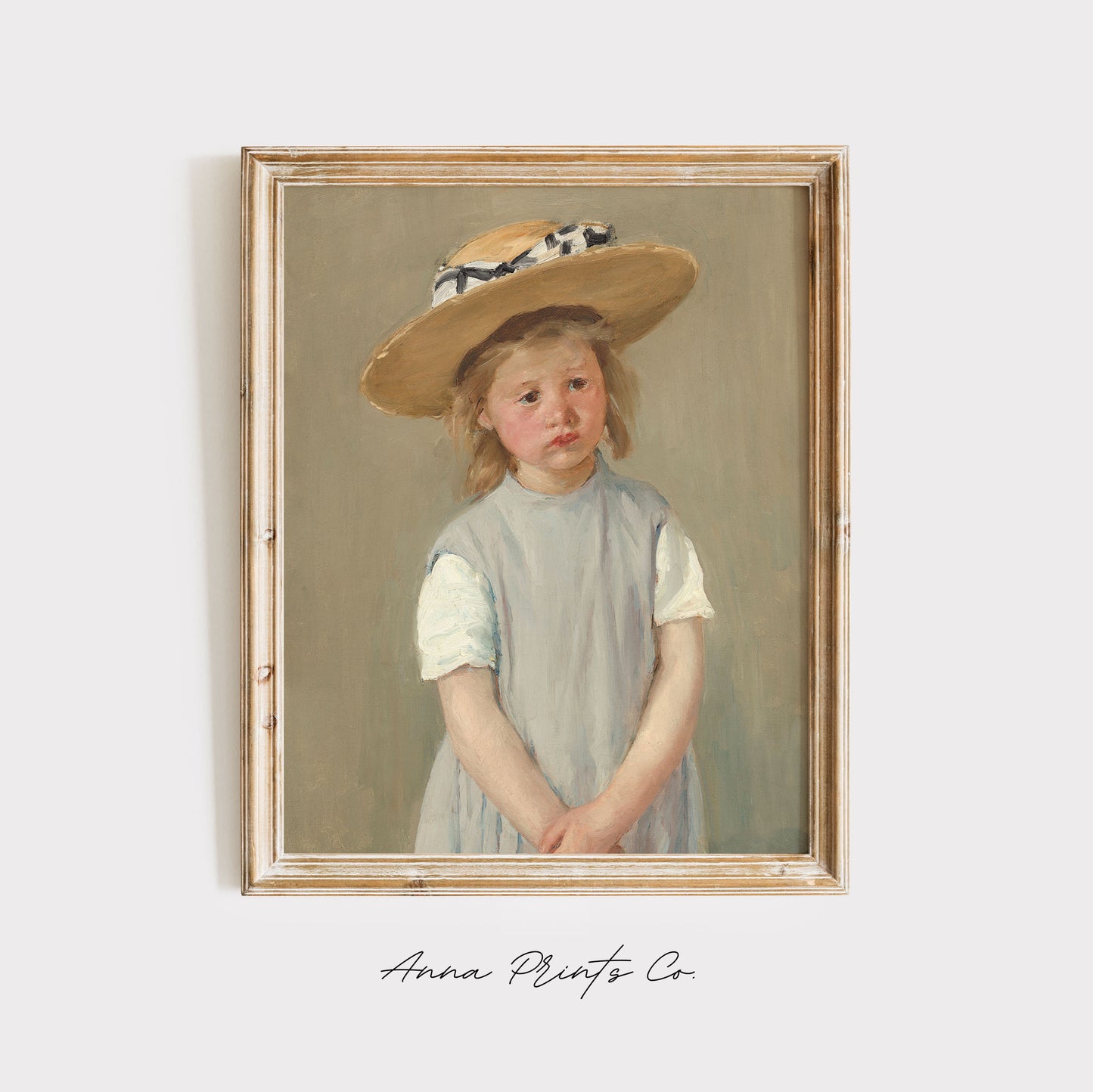 Vintage art print of Child in a Straw Hat by Cassatt displayed in wooden frame