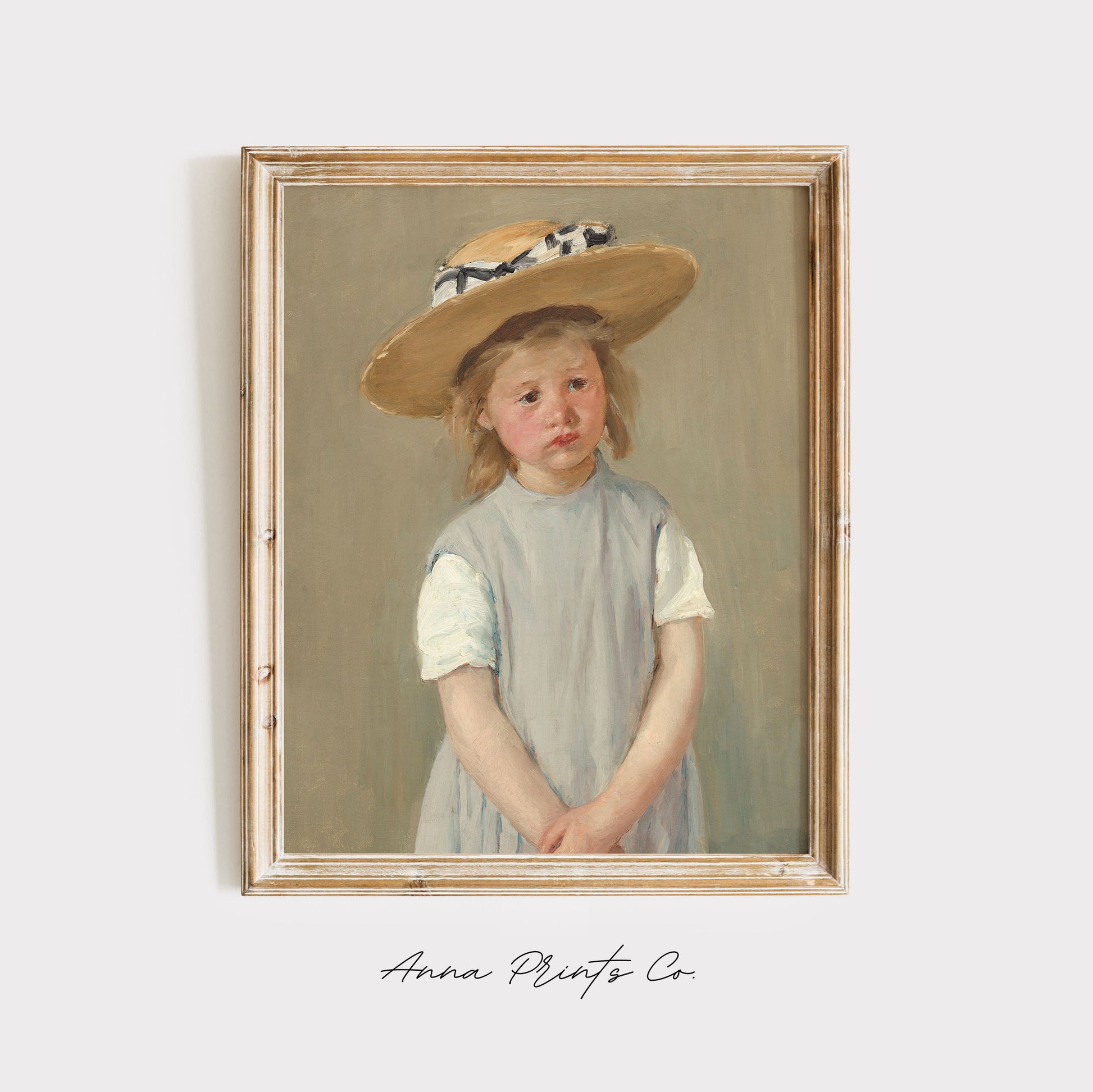 Vintage art print of Child in a Straw Hat by Cassatt displayed in wooden frame