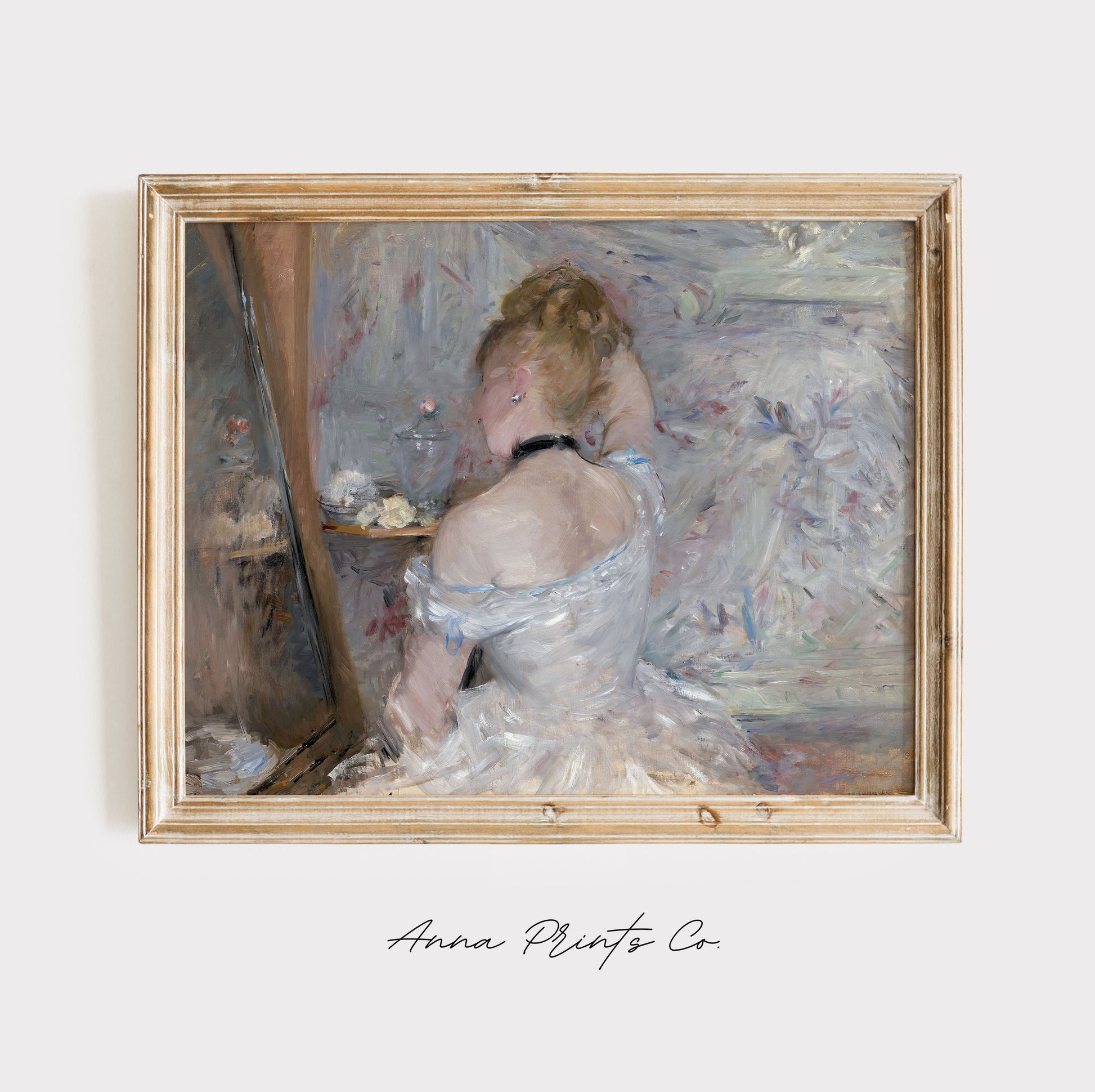 Vintage art print of Woman at her Toilette by Morisot displayed in wooden frame