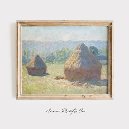 Vintage art print of Haystacks, end of Summer by Monet displayed in wooden frame