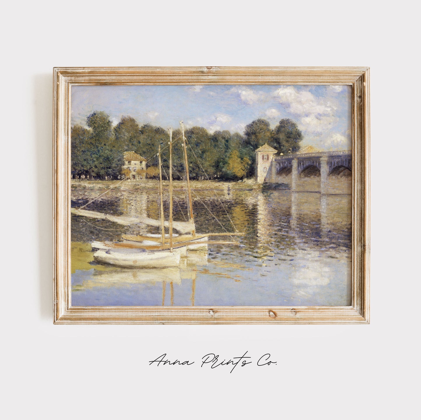 Vintage art print of The Argenteuil Bridge by Monet displayed in wooden frame
