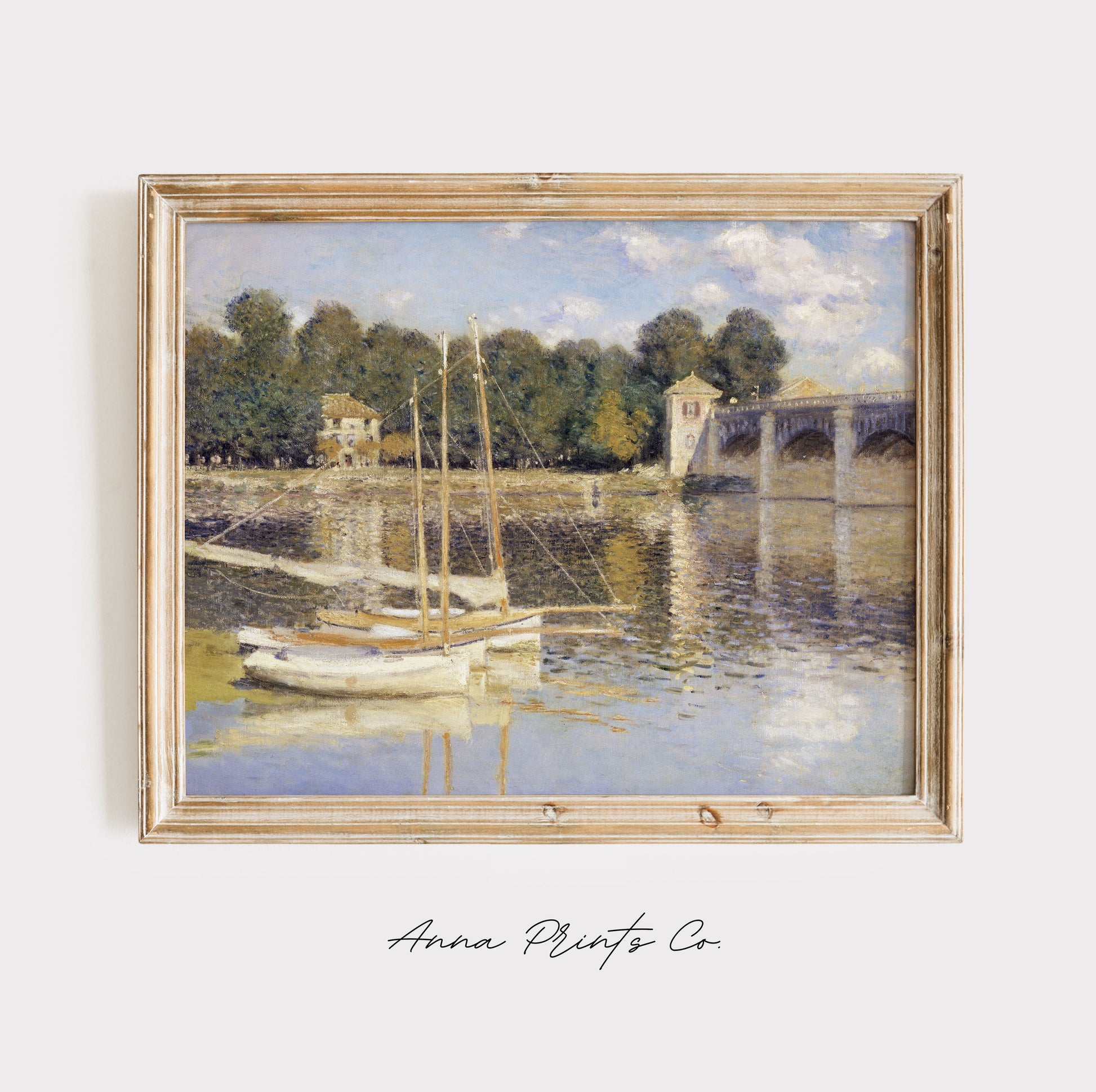 Vintage art print of The Argenteuil Bridge by Monet displayed in wooden frame