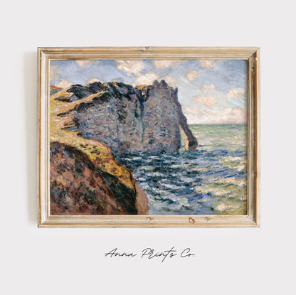 Vintage art print of The Cliff of Aval, Etretat by Monet displayed in wooden frame