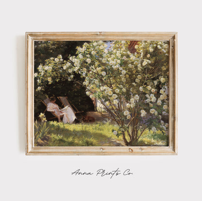 Vintage art print of Woman in Cottage Garden Painting displayed in wooden frame