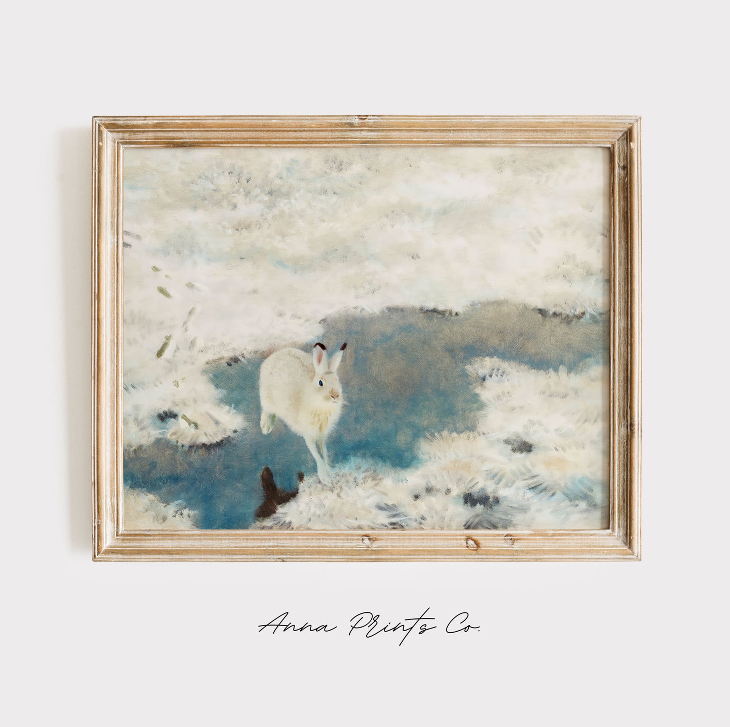 Vintage art print of Hare in Winter Snowy Landscape displayed in wooden frame