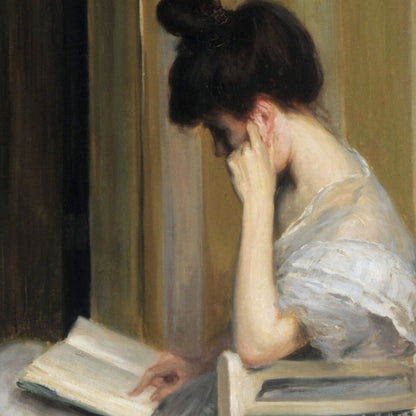 Woman reading a book in a softly lit room