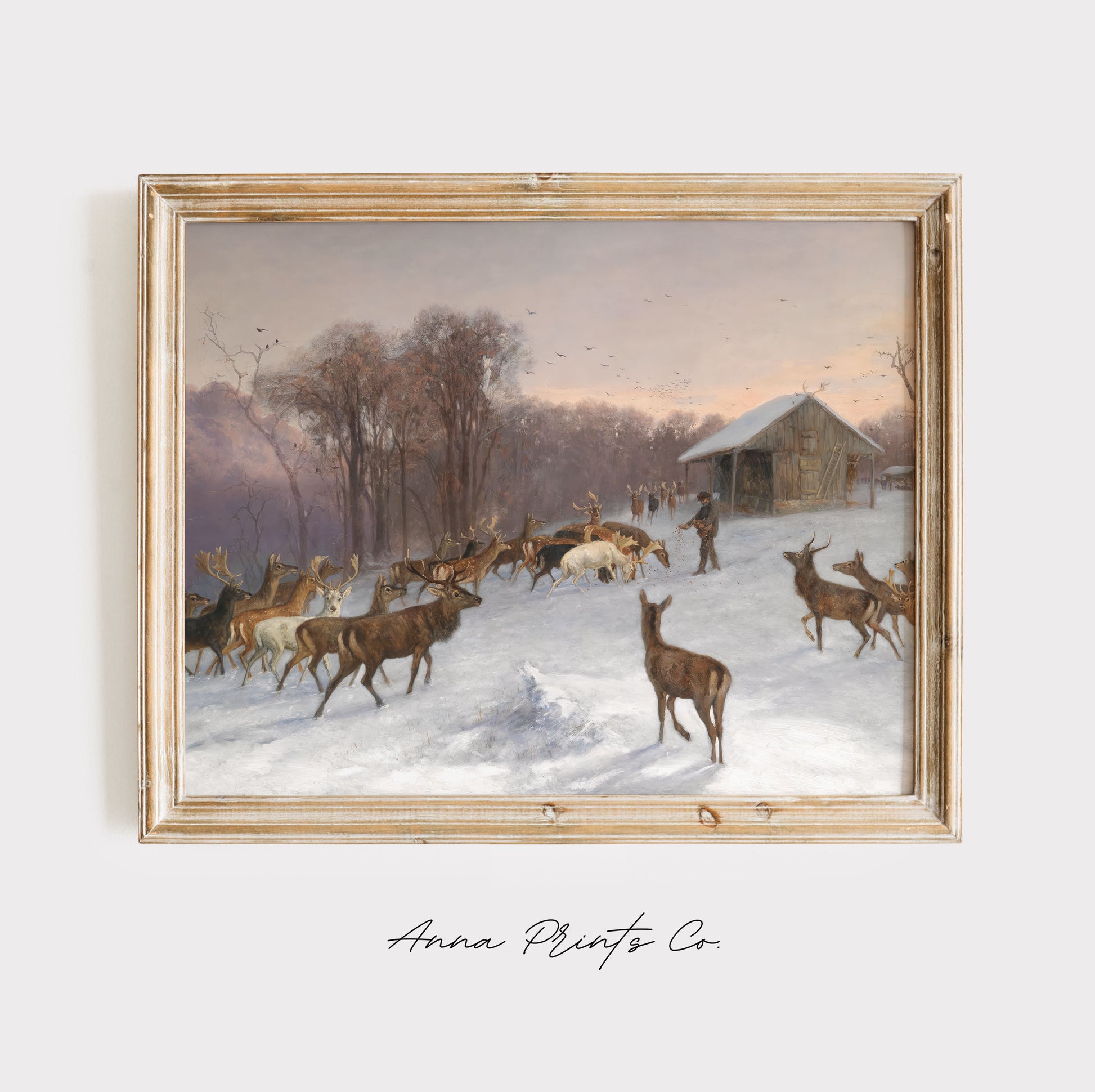 Vintage art print of Feeding Deer Winter Landscape displayed in wooden frame