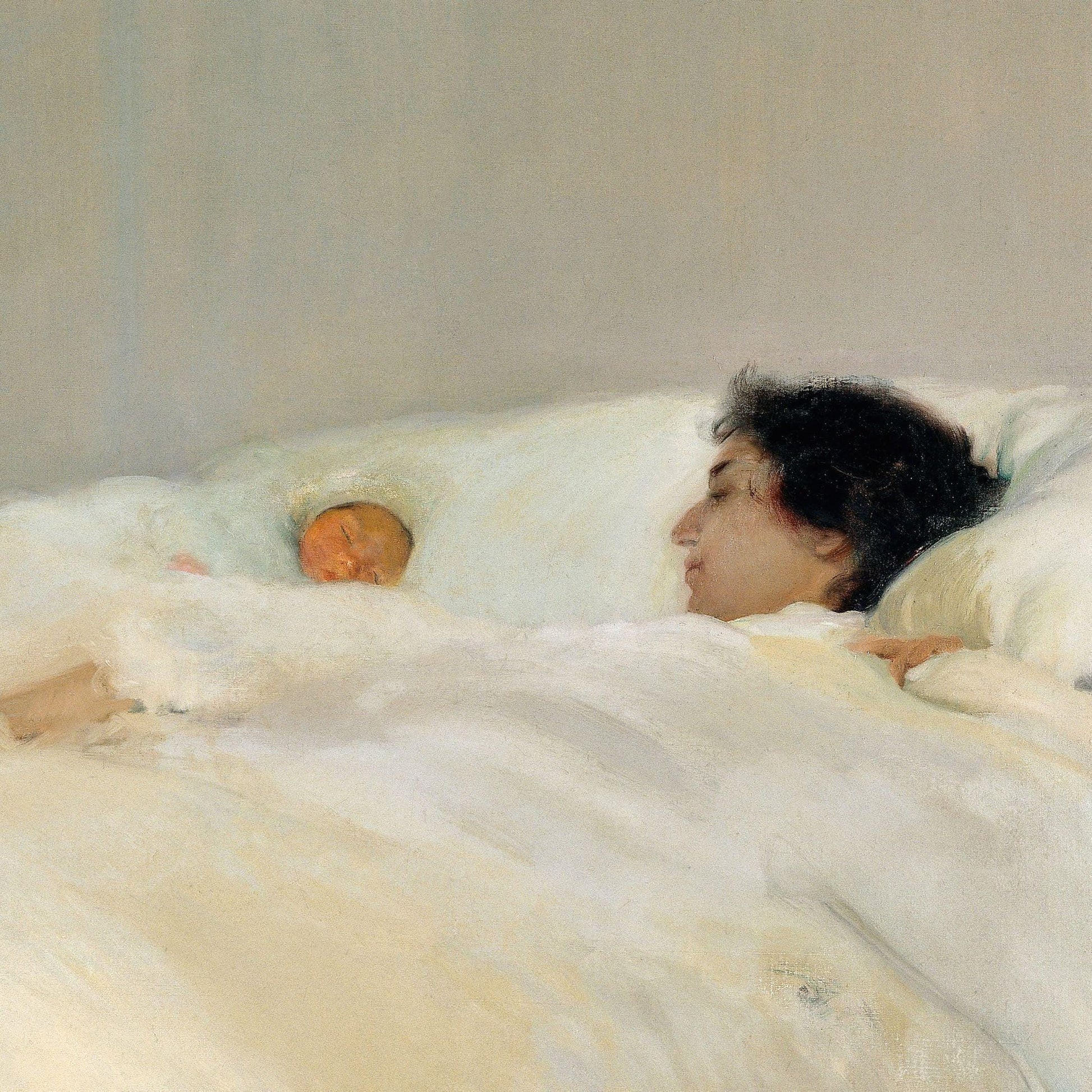 Two people lying in bed together, partially covered by white bedding.